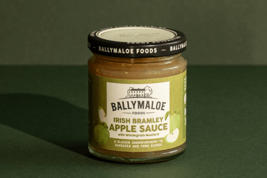 Immerse yourself in the sweet tanginess of Ballymaloe Irish Bramley Sauce, spotlighted in this website image. A jar filled with the luscious goodness of Irish Bramley apples for a delightful taste experience.