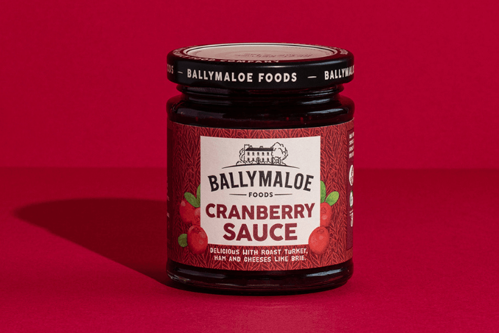 Capture the essence of the holidays with Ballymaloe Cranberry Sauce, showcased in this website image. A jar brimming with the tart and sweet goodness of cranberries, perfect for festive feasts.