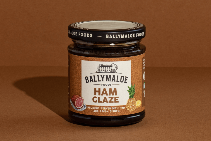 Transform your ham into a culinary masterpiece with Ballymaloe Ham Glaze, as seen in this website image. A jar filled with the perfect blend of sweetness and spices for a mouthwatering glaze.