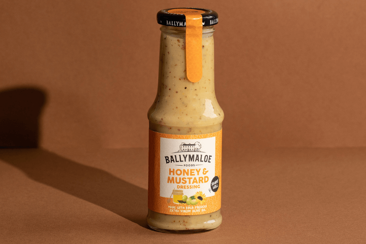 Elevate your salads with the delectable blend of Ballymaloe Honey & Mustard Salad Dressing, featured in this website image. A jar filled with the perfect balance of sweet and tangy goodness.