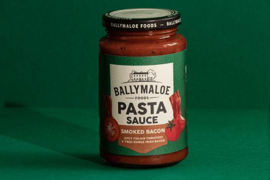 Experience the irresistible smoky flavor of Ballymaloe Smoked Bacon Pasta Sauce in this website image. A jar filled with the perfect blend of savory bacon goodness.