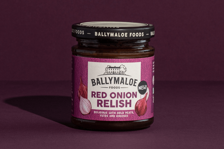 Explore the exquisite taste of Ballymaloe Red Onion Relish in this captivating website image. A jar brimming with rich, savory goodness, promising a delicious touch to your meals.