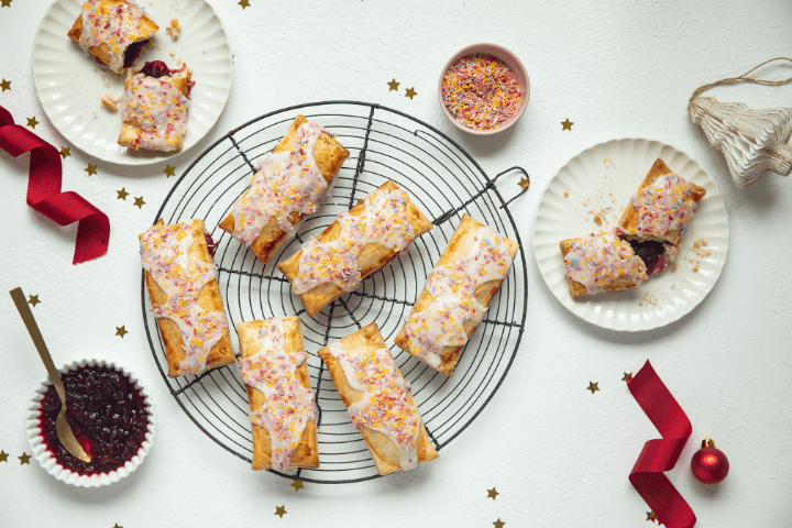 Delicious cranberry and lime pastry pockets, with a golden flaky crust, filled with sweet cranberry and tangy lime filling.
