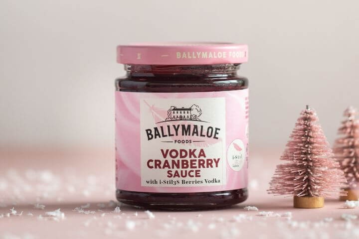 Close-up image of Ballymaloe Vodka Cranberry Sauce in an elegant jar with vibrant red cranberries and a touch of vodka, perfect for culinary inspiration.